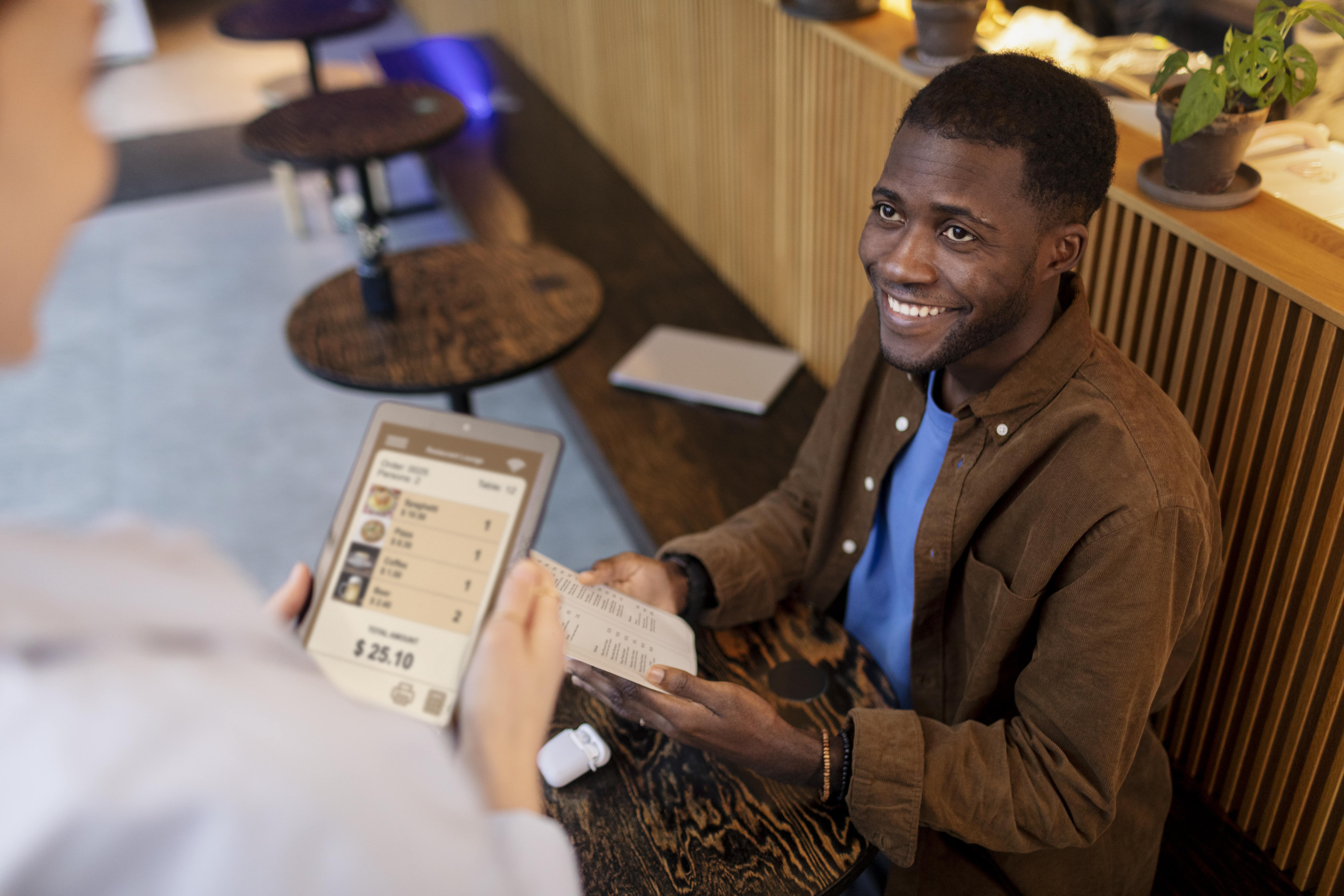 Restaurant staff using Sizzle system